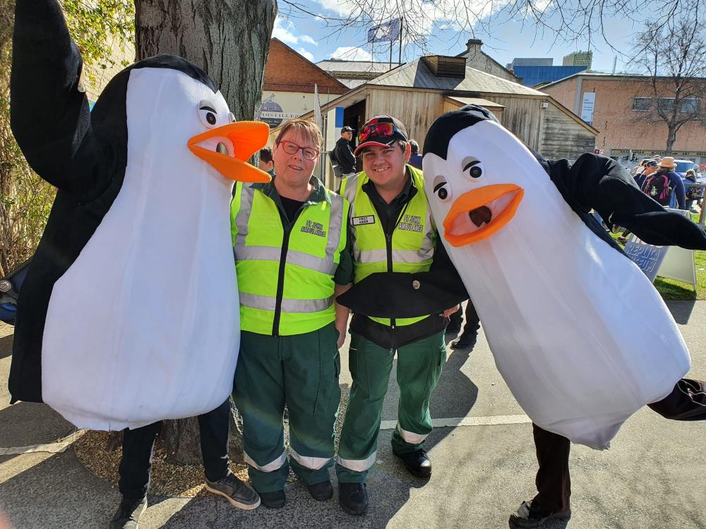 Event Health Service volunteers with penguin mascots