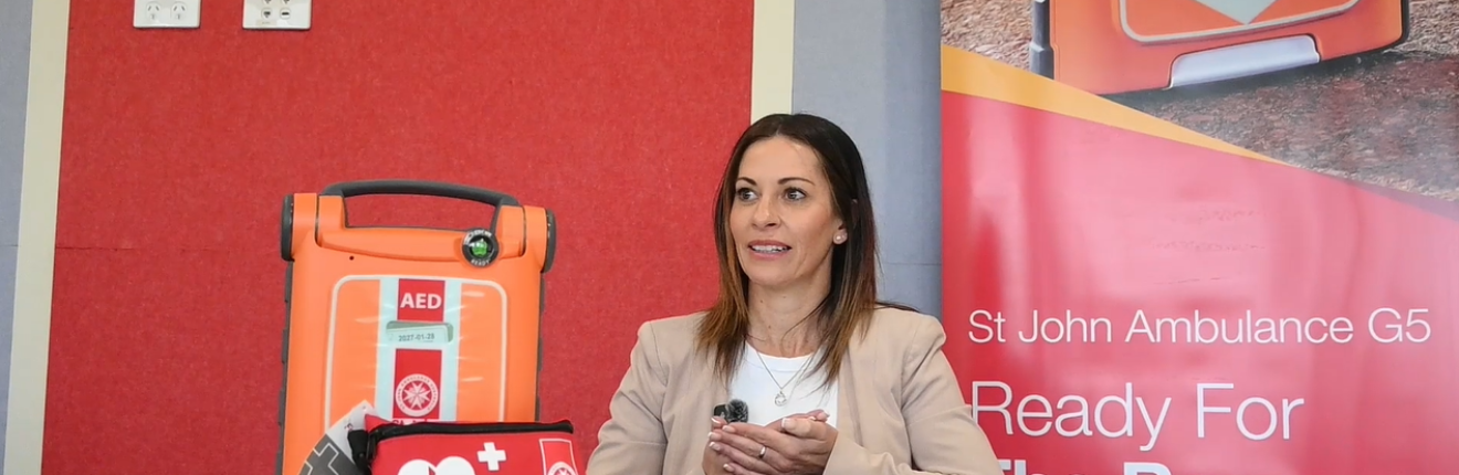 A woman being interviewed about first aid
