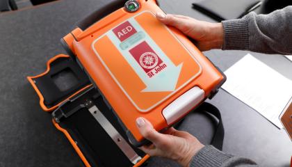 person holding g5 aed