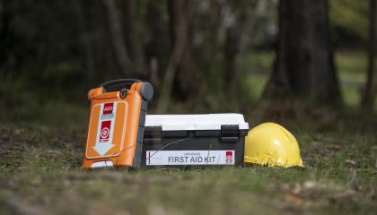 Defib, first aid kit and hard hat