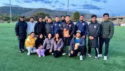 The Nepalese Football Club of Tasmania receiving their AED