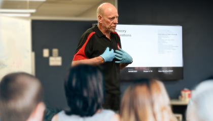 Trainer teaching First Aid
