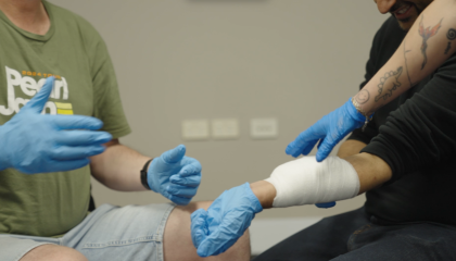 First Aid training class teaching bandaging skills