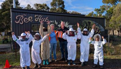 Junior Bee Keepers accepting their G5 AED Grant from St John 