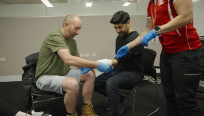 Trainer demonstrating bandaging