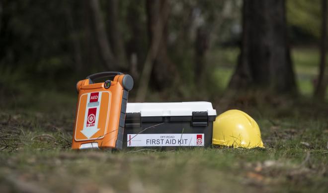 Defib, first aid kit and hard hat