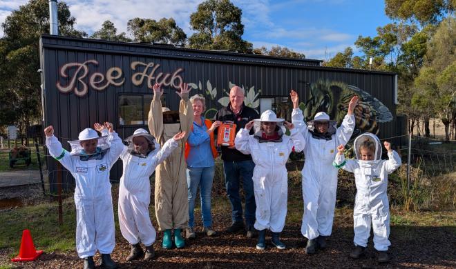 Junior Bee Keepers accepting their G5 AED Grant from St John 
