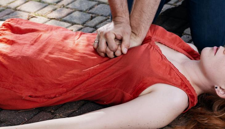 CPR being performed on a woman
