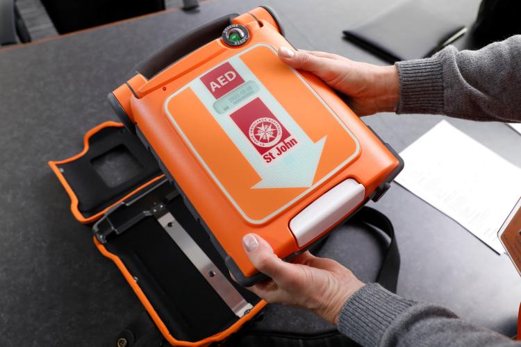 person holding g5 aed
