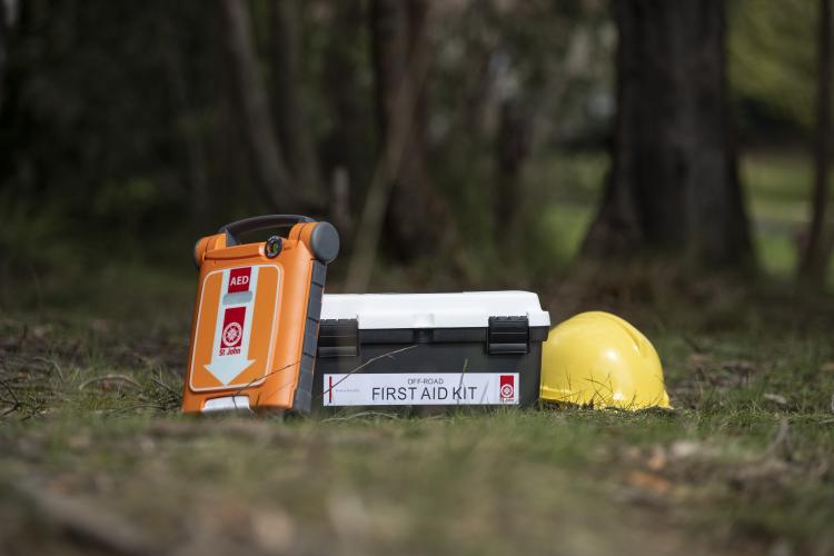 Defib, first aid kit and hard hat