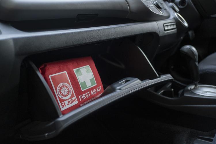 Glove box with a first aid kit inside