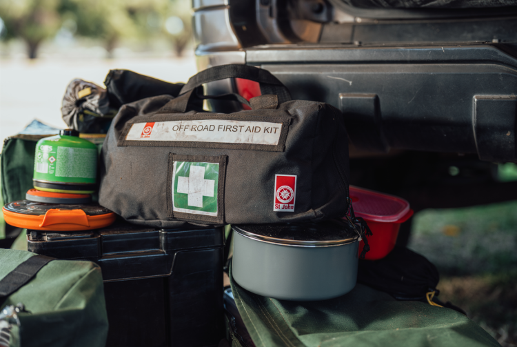 an off road first aid kit in the back of a ute