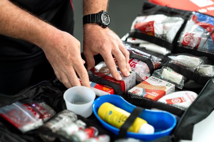 first aid kit open showing bandages